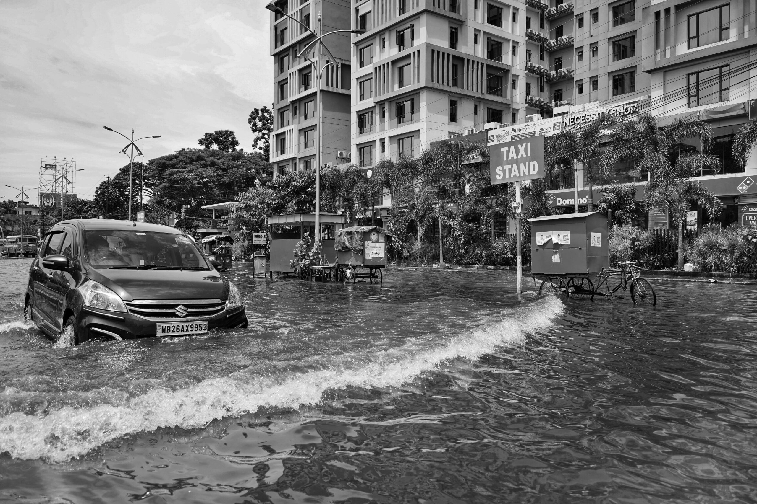 Photo of car on street during flood